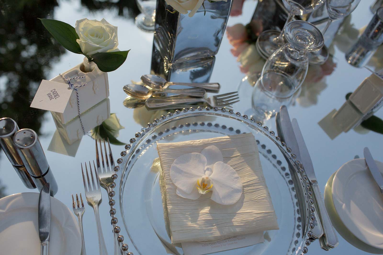 A table set with silverware and place settings.